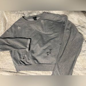 Gray cropped sweater with little torn holes for looks